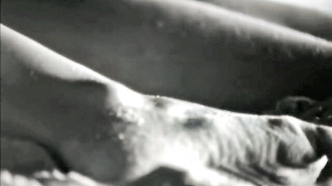 Vintage 1970s nude scene from The Set: side view of woman's bare breasts and curves