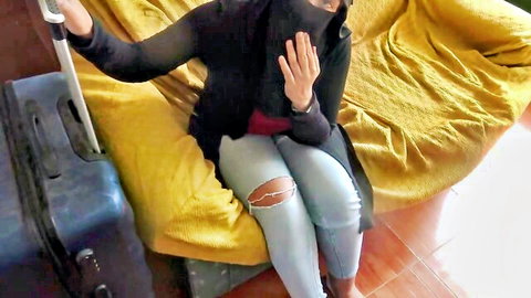 SouzanHalabi in hijab and ripped jeans sitting casually, amateur tease