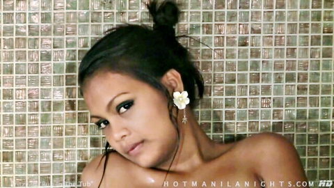 Pritzy topless in steamy tub rub, wet Asian beauty with bun hair and flower earring