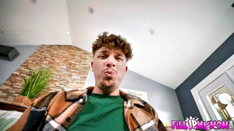 Curly-haired man pouting seductively in close-up POV shot