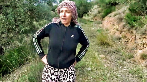Souzan Halabi mature amateur posing in tracksuit outdoors