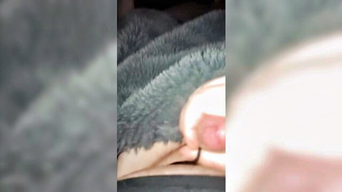 Blurry close-up of woman's exposed pussy under furry blanket, ginormous cumshot tease