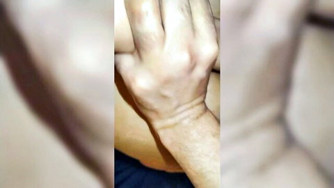 Blurry close-up of hand gripping wrist in exclusive hot Arab sex video