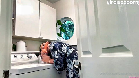 Dani Daniels bent over washing machine, dildo play in floral dress