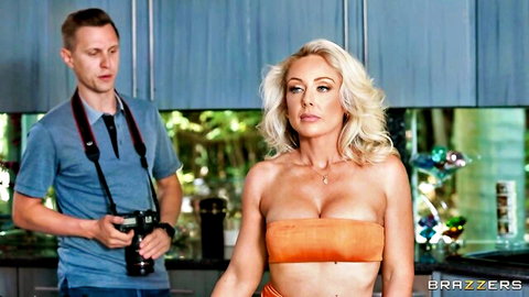 Bitchy blonde MILF boss in orange tube top with photographer