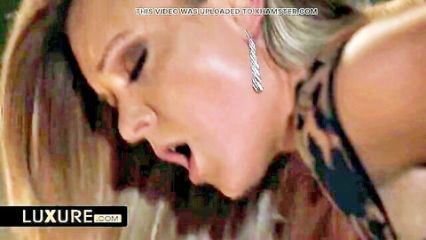 Blonde woman moaning ecstatically with wide open mouth during intense sex closeup