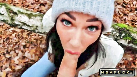 Freckled teen in woods teases with finger suck gesture, outdoor amateur vibe