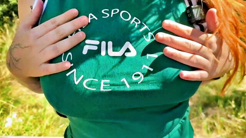 Yuki, 23yo redhead from Brussels, teasing cleavage in green Fila sports top