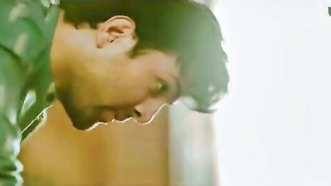 Intense close-up of handsome Desi man in green shirt, Palang Tod Siskiyaan