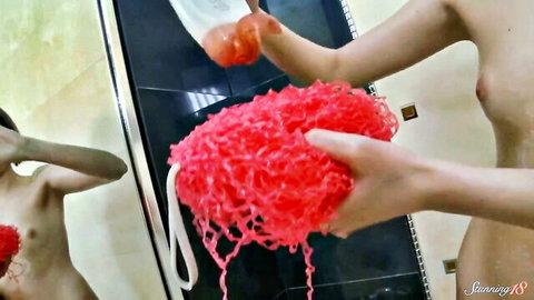Petite brunette teen Livilla nude in steamy bathroom holding red sponge