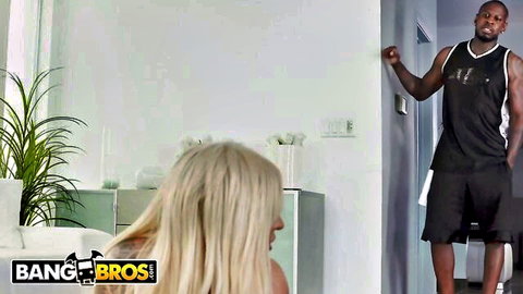 Blonde bombshell with huge hanging tits bends over bathroom sink looking back at muscular black stud ready to fuck.