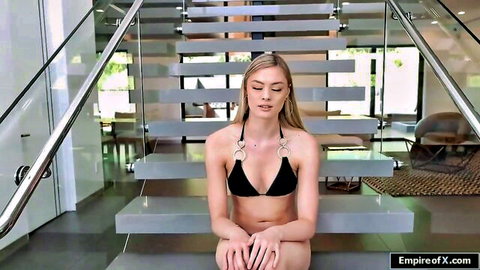 Amber Moore in black ring bikini, seductive pose on stairs