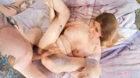 Tattooed TS beauty with big tits fucked spooning by muscular guy on bed