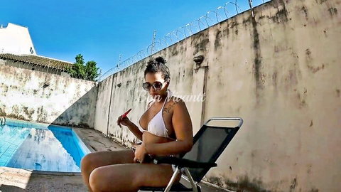 Curvy Latina mom in white bikini lounging by pool with huge ass