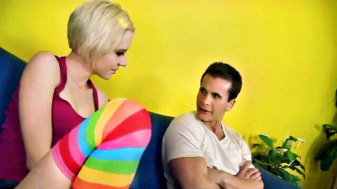 Blonde Kelly in pink tank top and rainbow thigh-highs teasing man