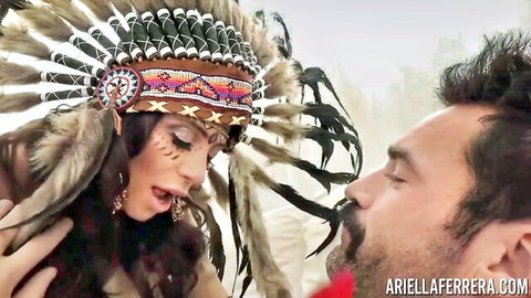 Ariella Ferrera as busty MILF in Native headdress kissing stud
