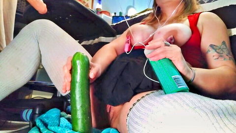 Daisy Wylde breastfeeding baby while inserting cucumber in pussy