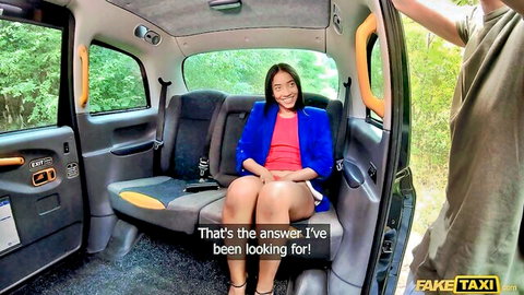 Smiling mixed-race woman in blue blazer and short skirt in taxi, legs spread teasingly