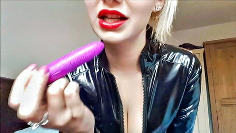 Bad Dolly teases with purple vibrator in shiny black latex catsuit