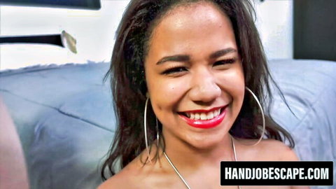 Loni Legend smiling seductively in POV handjob scene, ebony star