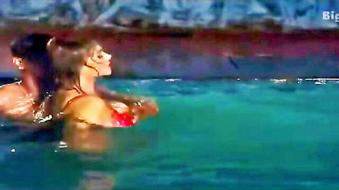 Brunette babe with big tits in red bikini pressed against man in pool water