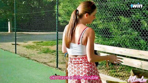 Mila L in short tennis skirt on court, ponytail tease from behind
