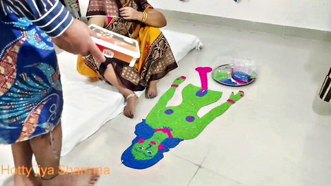 Indian stepmom in sari with erotic green rangoli nude figure on floor