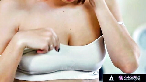 Serena Blair in white sports bra, hands on breasts, teasing cleavage in massage