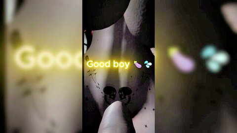 Nude woman bending over from behind, finger teasing ass, neon 'Good boy' text