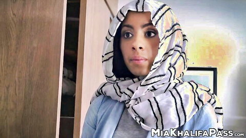 Mia Khalifa in striped hijab and casual outfit, seductive gaze