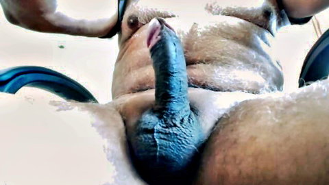 Hairy man with erect blue-tinted cock in close-up gay solo porn