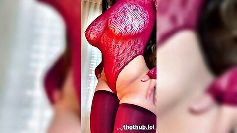 Curvy brunette in sheer red lace lingerie exposing huge tits and bare pussy mound