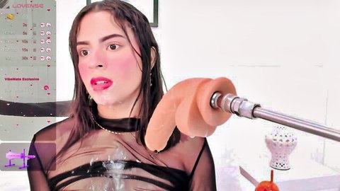 Wet webcam girl in sheer black top holds massive orange dildo to her open mouth teasing suck