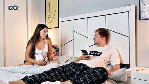 Shy teen stepsister in white lingerie chats with stepbrother on bed