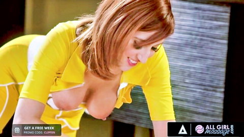 Redhead masseuse in revealing yellow lingerie exposing big tits during erotic bodyrub