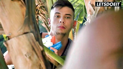 Young Latino stud La Paisita Oficial hides with water gun in tropical tease