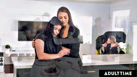Kira Noir and Bella Rolland emotional embrace in black at wake