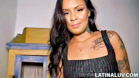 Tattooed Latina Evelyn Buarque in sexy black top, teasing smile