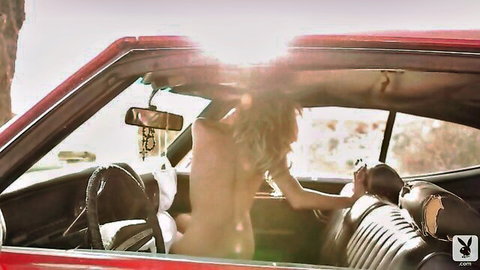Dani Mathers topless in red convertible with handsome driver