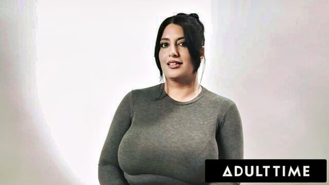 Sarah Arabic in tight gray top showing immense cleavage in Adult Time interview