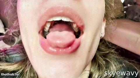 Blonde woman wide open mouth with tongue out in sloppy oral tease