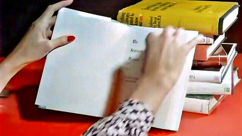 Hands with red nails holding open book amid stacks, for Hardcore Pornstar In Big Butt Trannies