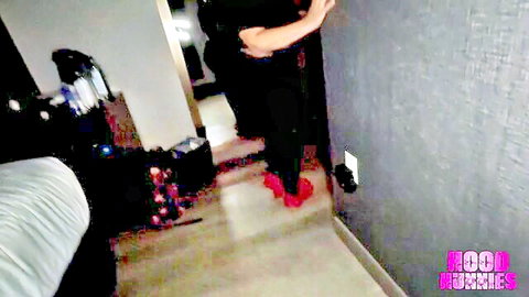 Big ass ebony babe in tight black pants and red heels teased by guy in dim hallway