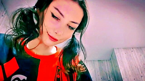 Seductive brunette with pigtails smirking in black red cosplay closeup POV