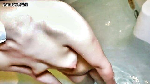 Uncensored Asian amateur nude woman bending over in bathtub