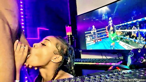 Ebony woman with braids gives passionate POV blowjob watching wrestling