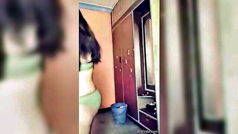 Indian beauty undressing in sexy green bikini, curvy figure tease