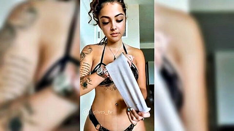 Tattooed Latina Malu La Cubana posing in sexy white bikini