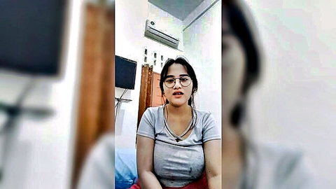 Indonesian Acha Mango in viral live stream showing deep cleavage in tight top