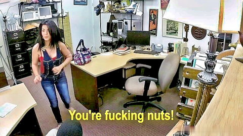 Brunette Latina in red bustier top and jeans yelling angrily in office
